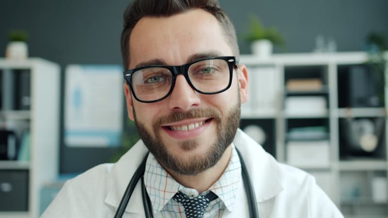 Smiling doctor with glasses and a stethoscope